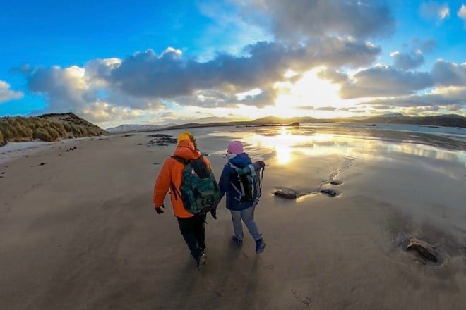 Two people walking on Balnakiel beach