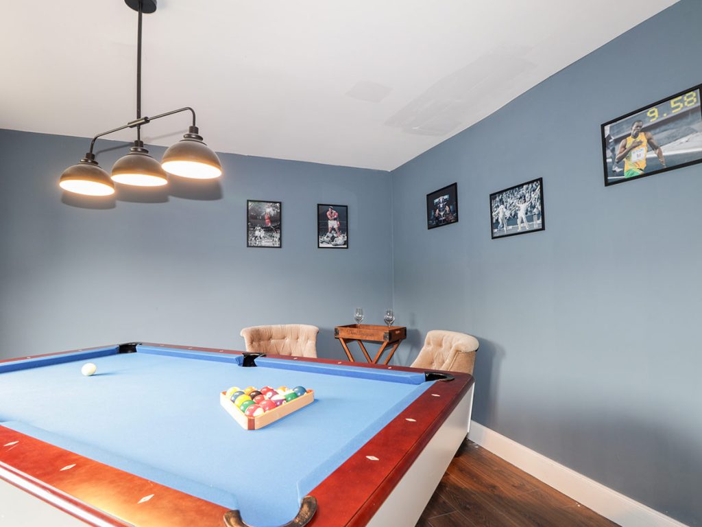 pale blue pool table with overhanging lights Challenger Lodge Lairg