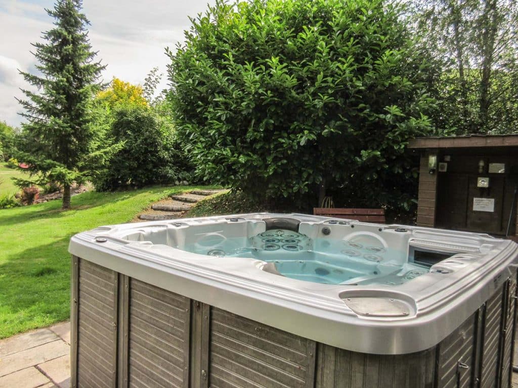 outdoor hot tub in garden of holiday cottage scotland