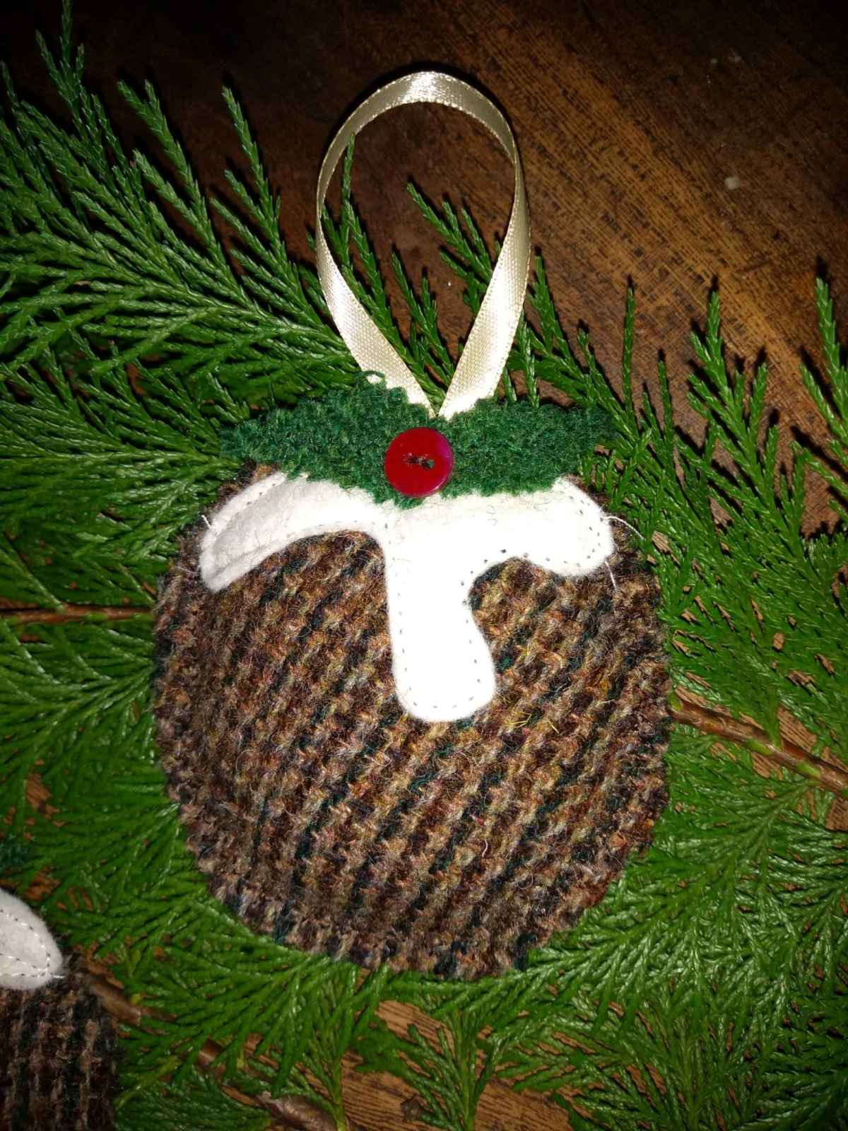 harris tweed christmas pudding with sauce and holly
