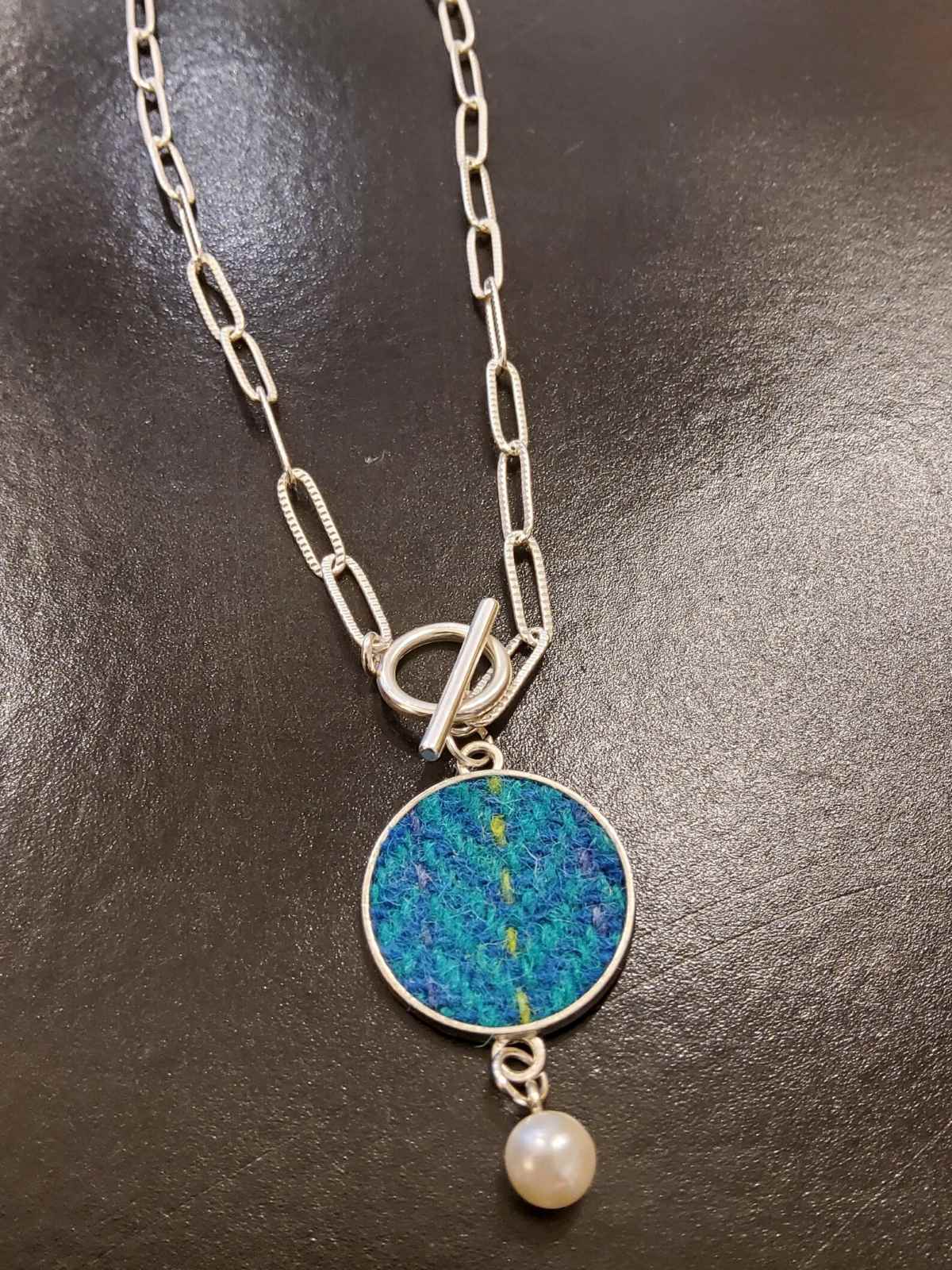 Harris tweed necklace with teal circle pendant on silver chain