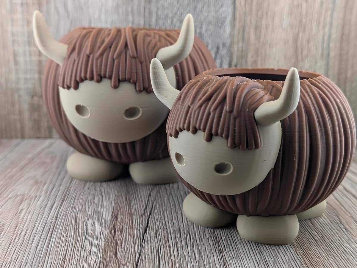 Two highland cow plant pots
