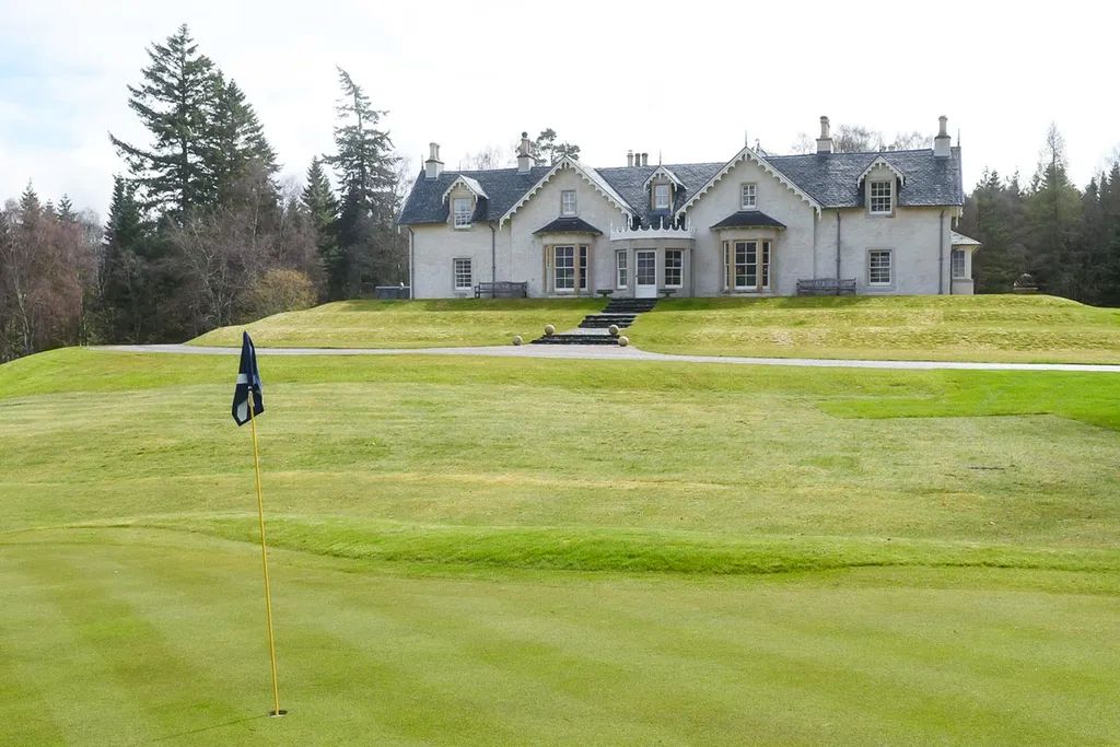 Spey Valley House former HIghlands hunting lodge with private golf course in foreground