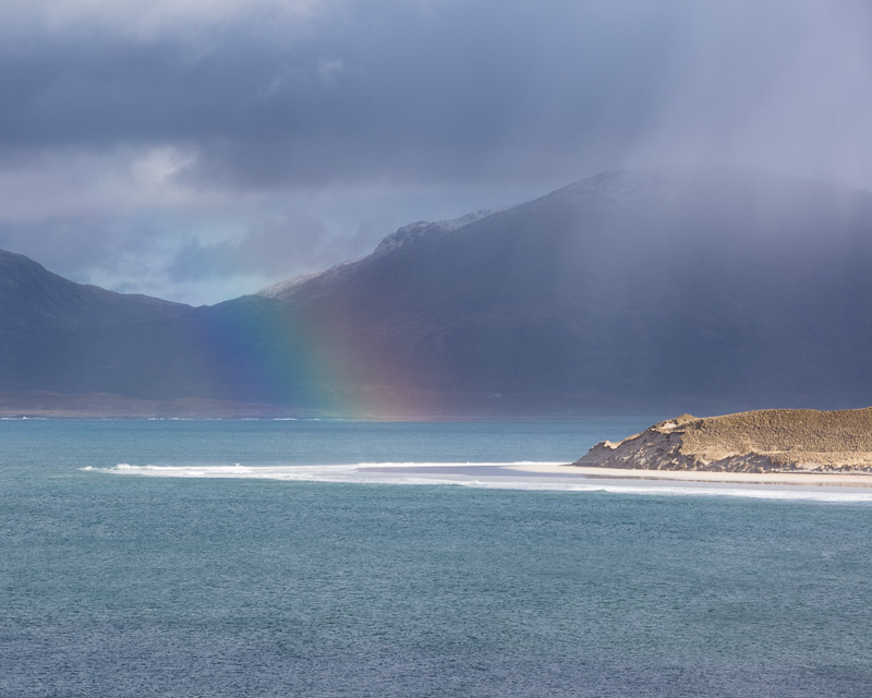 Sun and Rain - The Outer Hebrides is prone to very changeable weather and light, and the latter can be remarkable, with a quality and purity seldom matched anywhere else that I've seen. If you don't like the weather, wait five minutes! In this case, sun rays streamed through a break in the windswept clouds, highlighting a rainshower, and the refracted light formed a rainbow. Sound of Taransay and Luskentyre Beach on the west coast of the Isle of Harris, looking towards the North Harris Hills (Forest of Harris).