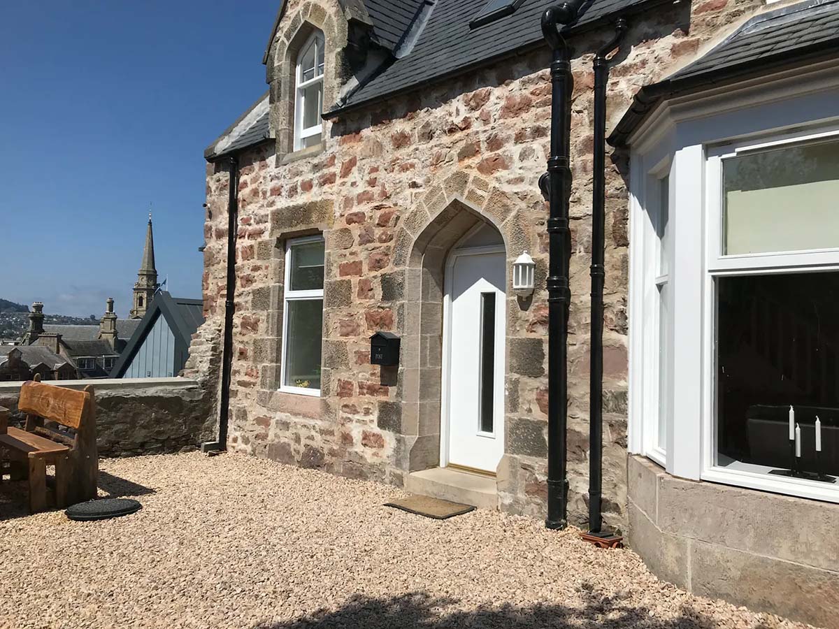 Inverness holiday cottage traditional stone 2-storey cottage with gravel